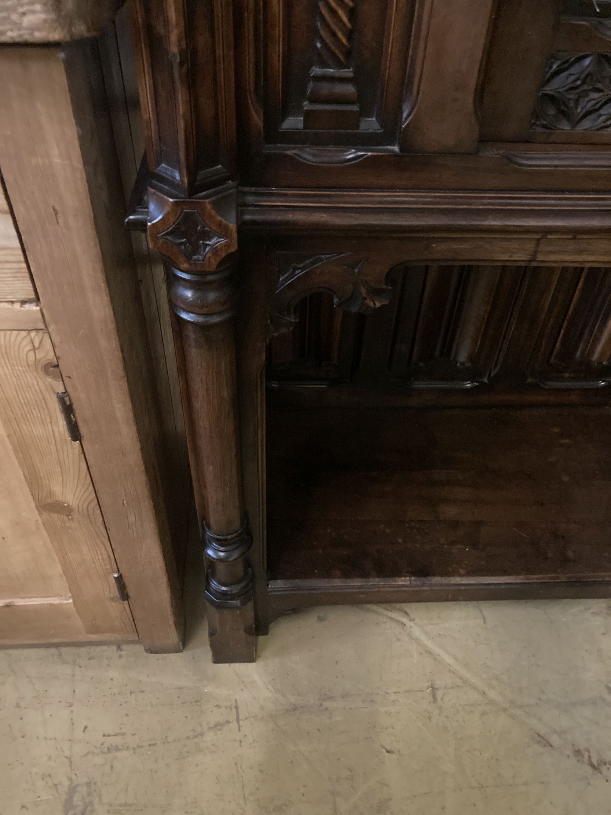 A medieval style carved walnut side cabinet, width 90cm, depth 44cm, height 140cm